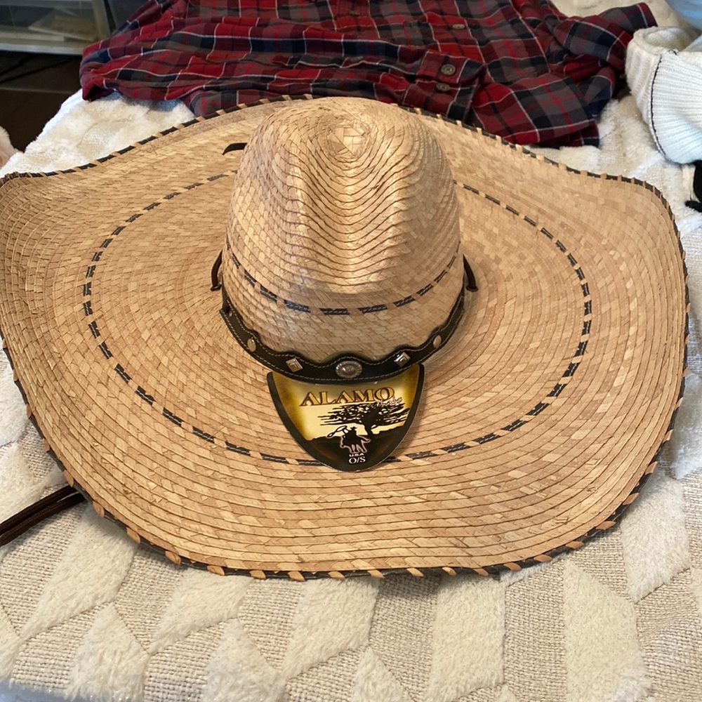 Oversized straw Sombrero style hat.